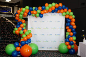 Photo background decoration bordered by different color balloons.