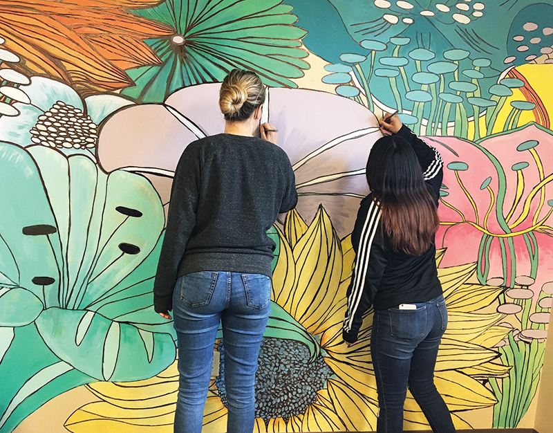 Chelsea & Jenny work on an mural at Franklinton Preparatory